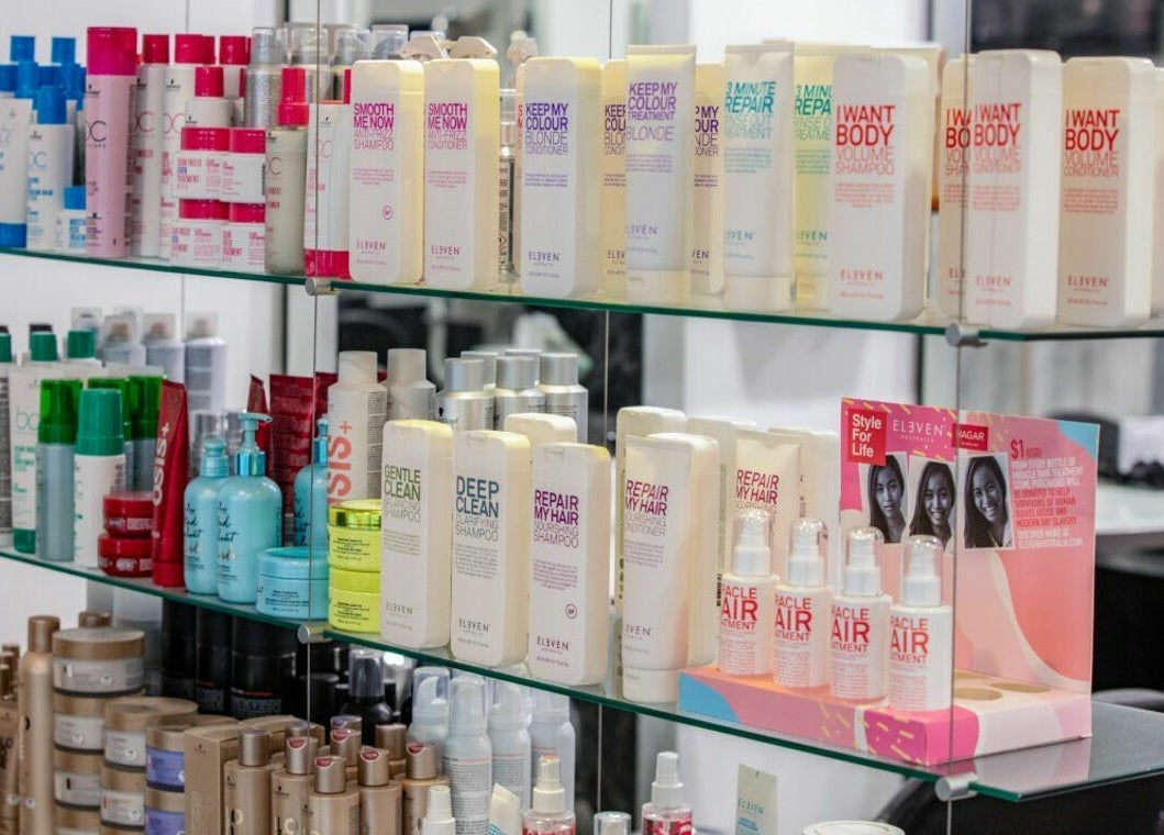 Assorted hair care products on shelves at Maddness Hair Design, Bundoora, Victoria, AU.