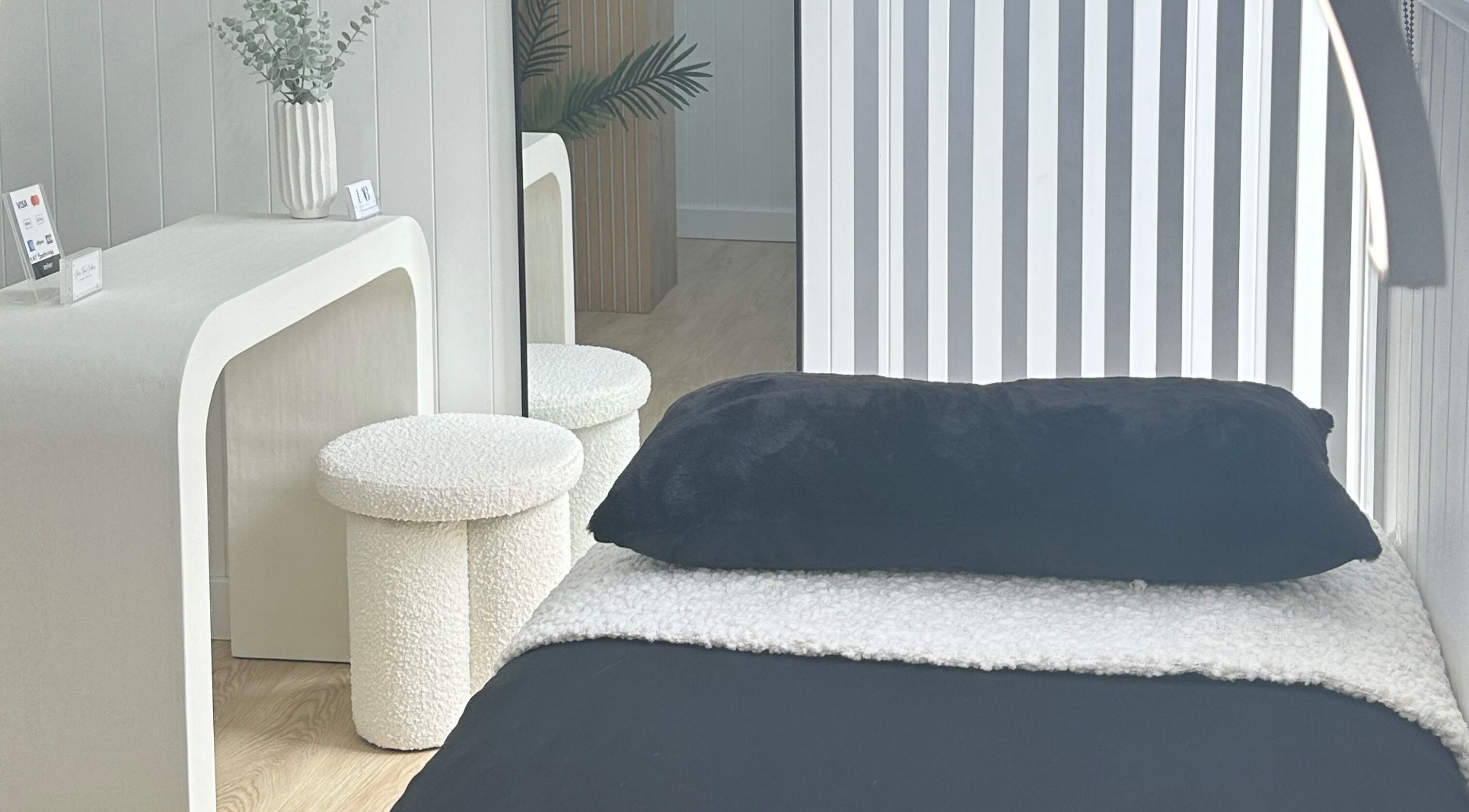 Relaxing therapy room at Lab Lounge, Blacksmiths, New South Wales, AU, featuring a plush bed and modern decor.