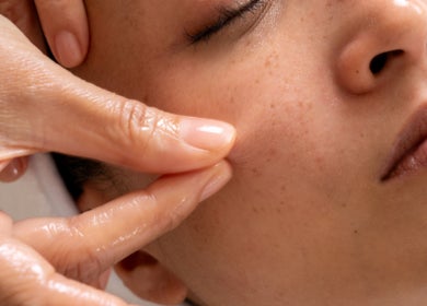 Facial massage at Maison Ysaé - Gaysorn Amarin, Krung Thep Maha Nakhon, TH, promoting relaxation and wellness.
