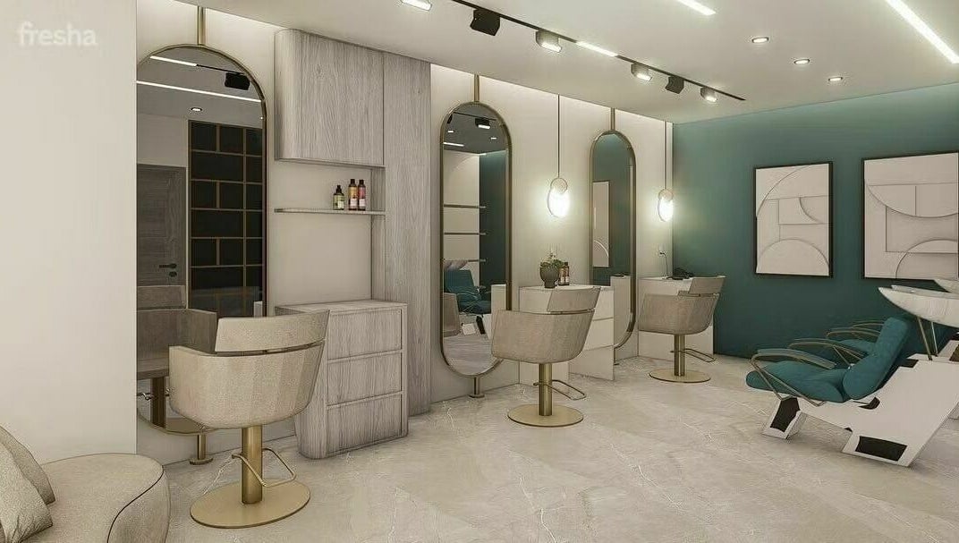 Modern salon interior at Leen Beauty Center, Aqaba, Aqaba Governorate, JO, featuring chic mirrors and seating.