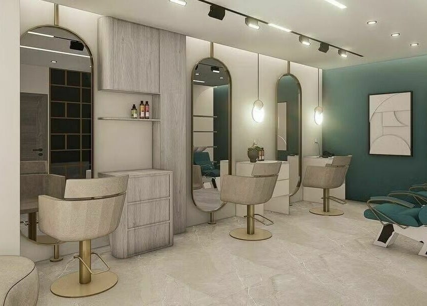 Modern salon interior at Leen Beauty Center, Aqaba, Aqaba Governorate, JO, featuring chic mirrors and seating.