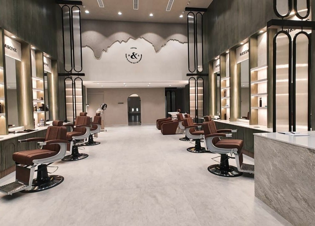 Stylish interior of Handsome - هاندسم salon in Riyadh, Riyadh Province, SA showcasing modern design and luxury seats.