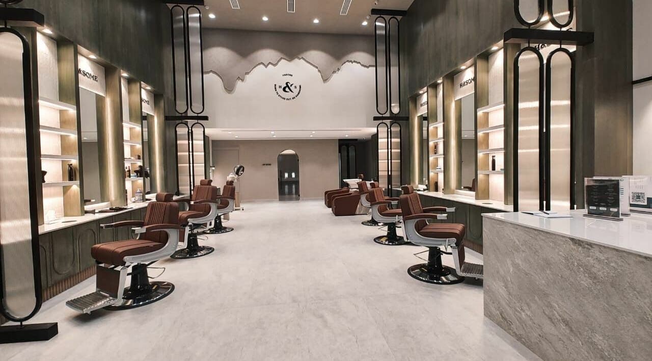 Stylish interior of Handsome - هاندسم salon in Riyadh, Riyadh Province, SA showcasing modern design and luxury seats.