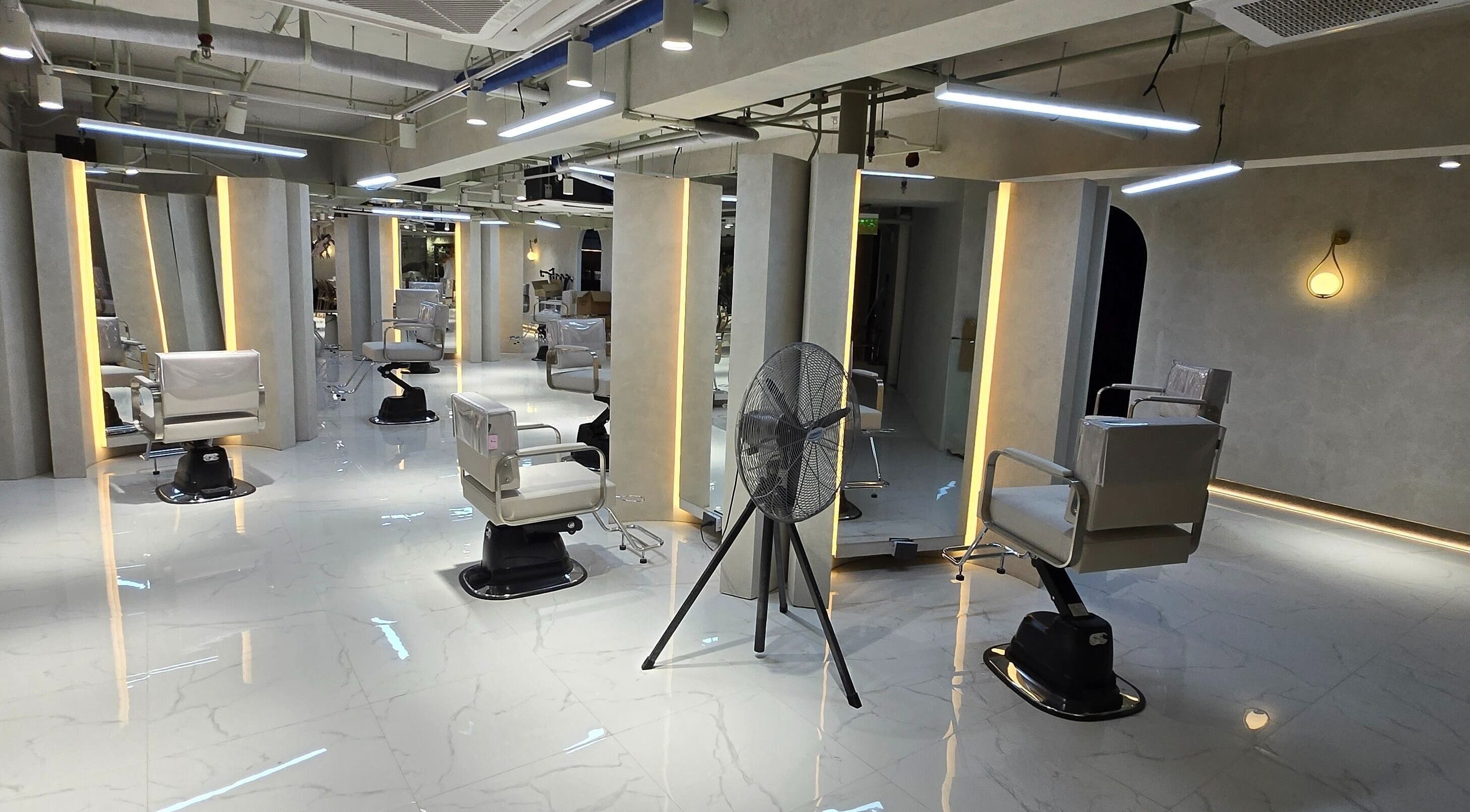 Modern interior of Daol Salon - Aseana in Parañaque, Metro Manila, PH featuring stylish salon chairs and lighting.