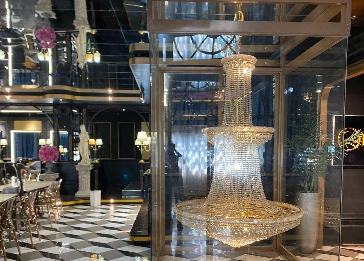 Elegant interior of Daol Salon Malate in Manila featuring a stunning chandelier and stylish decor.