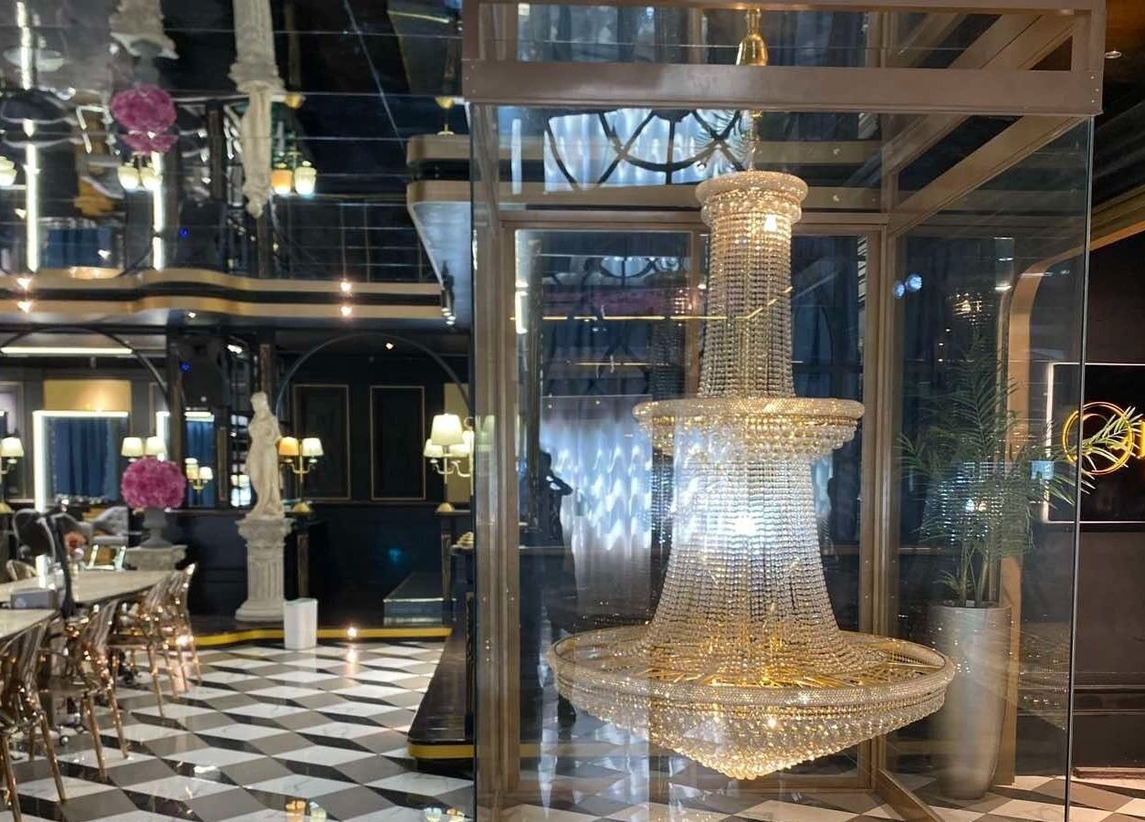 Elegant interior of Daol Salon Malate in Manila featuring a stunning chandelier and stylish decor.