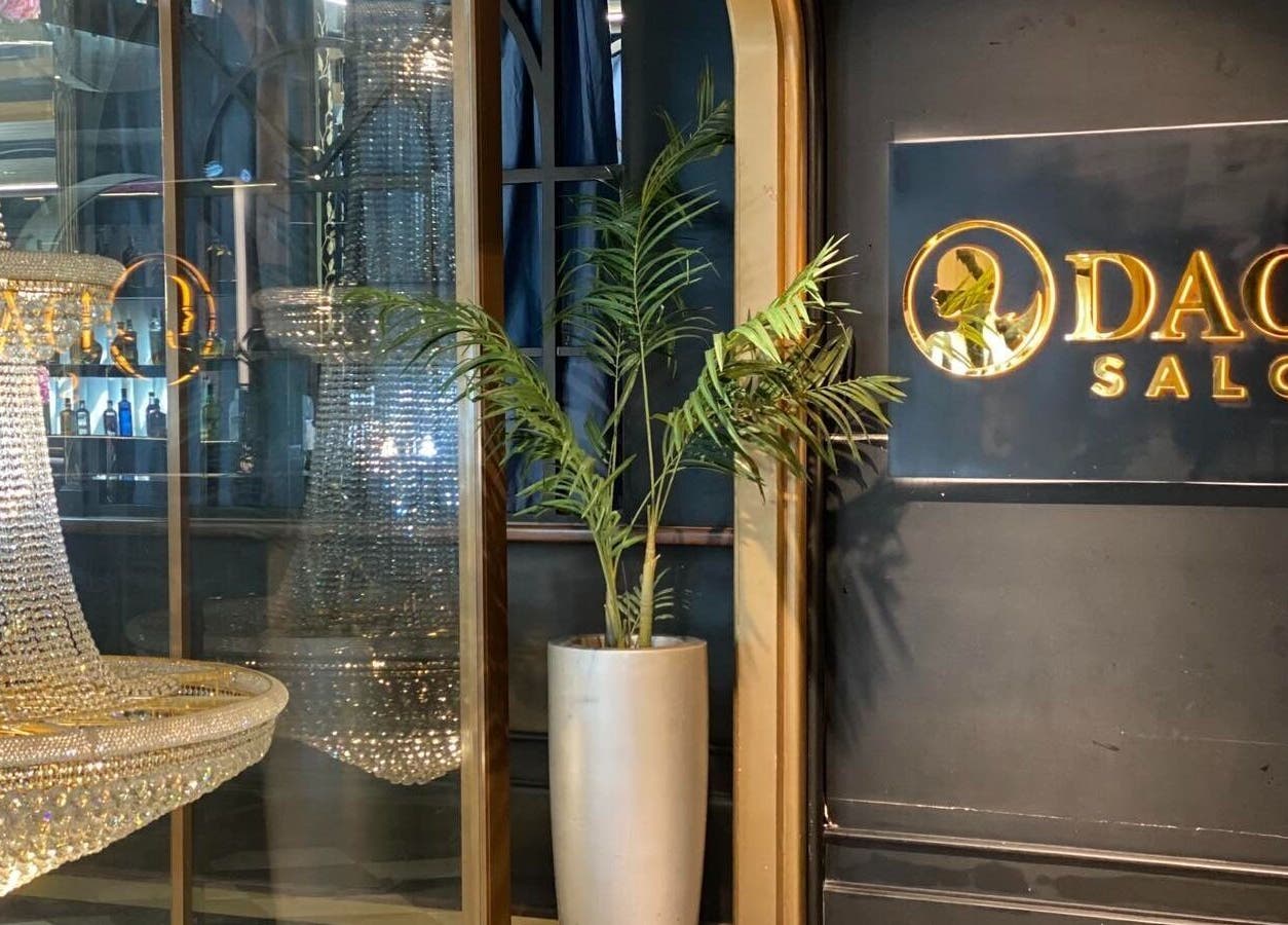 Chic chandelier and Daol Salon Malate logo at elegant entrance in Manila, Metro Manila, PH.