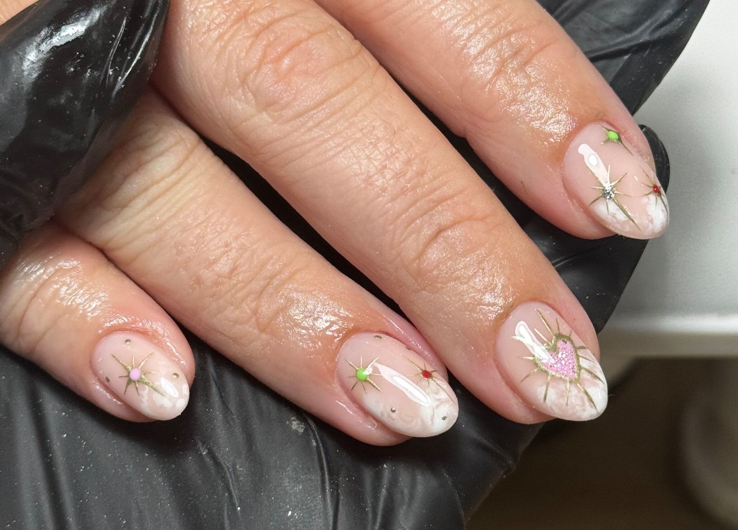 Elegant nail art at Chloe’s Beauty Spot, Torquay, England, GB featuring intricate designs and glossy finish.