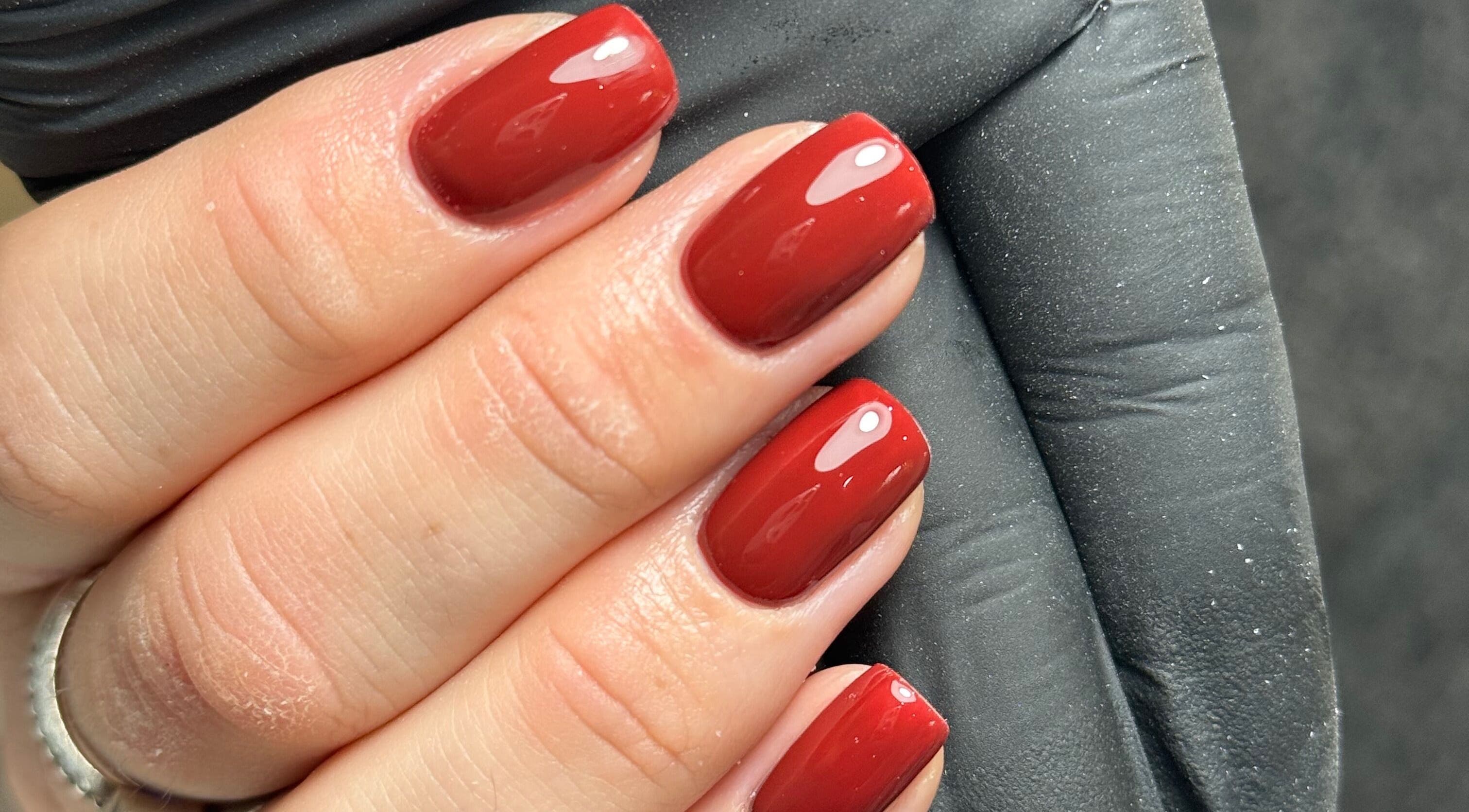 Elegant red manicure at Chloe’s Beauty Spot, Torquay, England, GB. Perfect for stylish nail care.