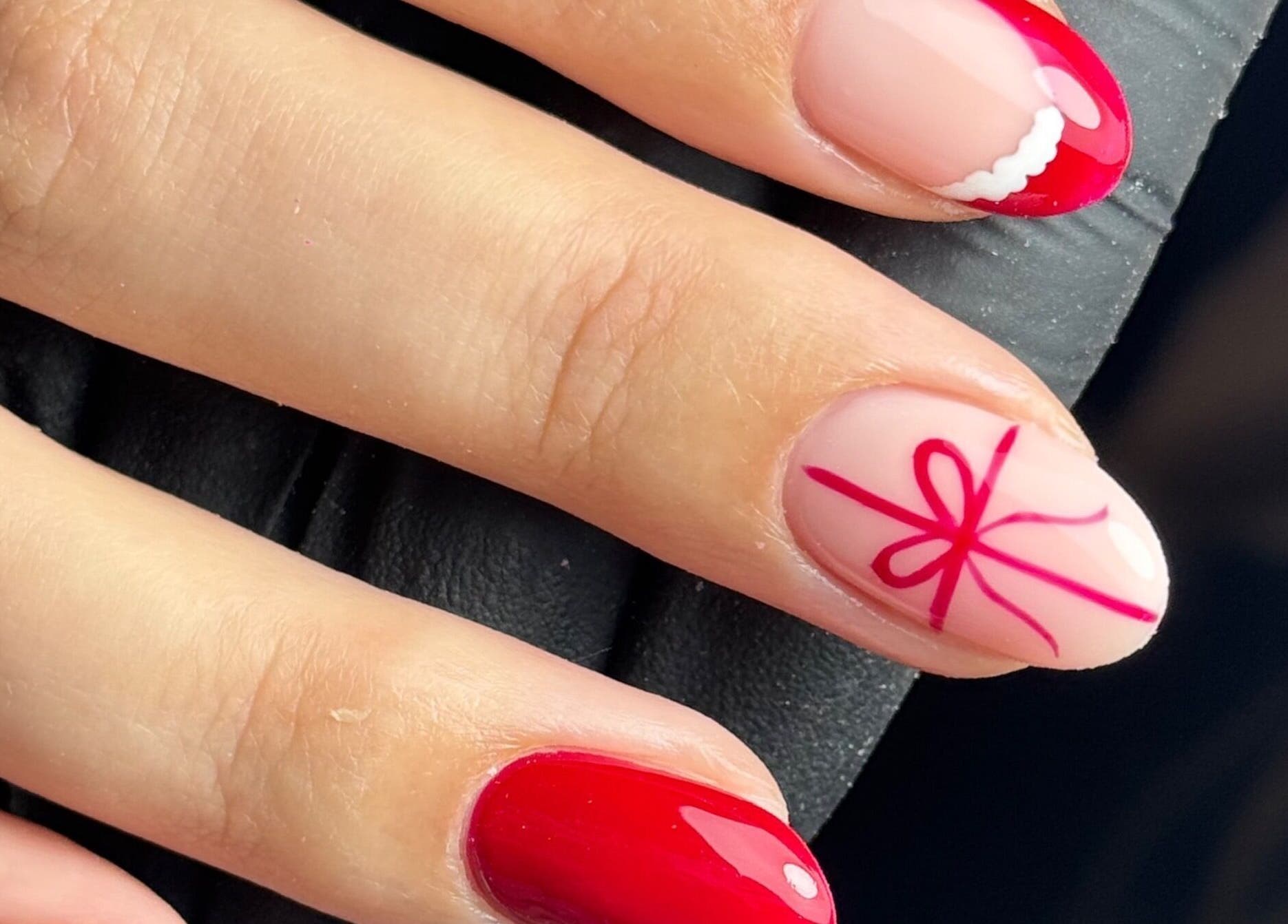 Elegant red and pink nail art design at Chloe’s Beauty Spot in Torquay, England, GB.