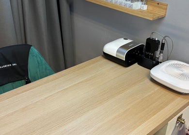 Modern nail spa station at Beauty Mi, Sunbury-on-Thames, England, GB with elegant equipment and seating.