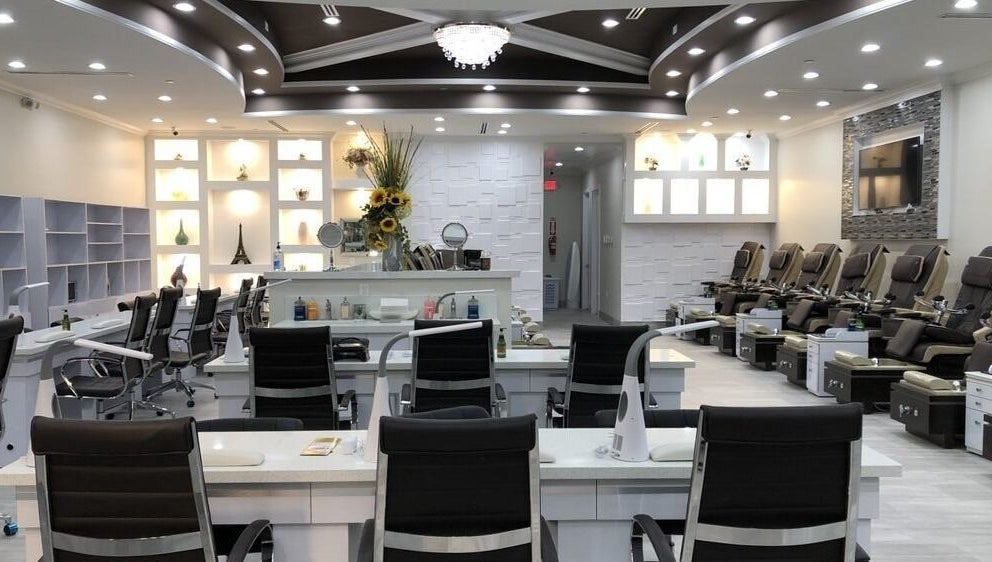 Elegant interior of D'Luxe Nail-Ocotillo in Chandler, Arizona, US, showcasing chic modern pedicure stations.