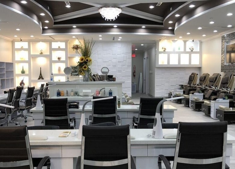 Elegant interior of D'Luxe Nail-Ocotillo in Chandler, Arizona, US, showcasing chic modern pedicure stations.