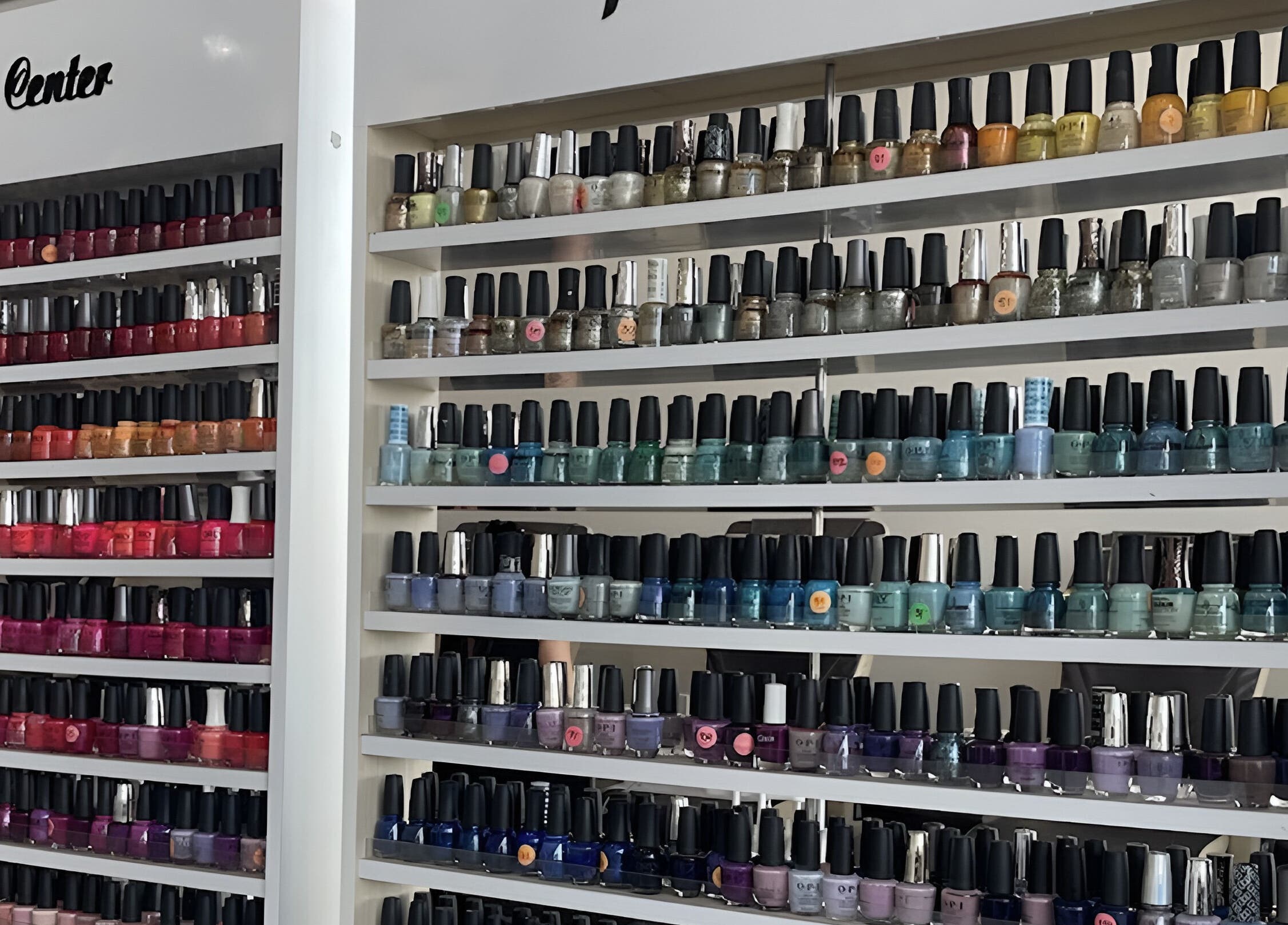 Colorful wall of nail polishes at D'Luxe Nail-Ocotillo, Chandler, Arizona, US.