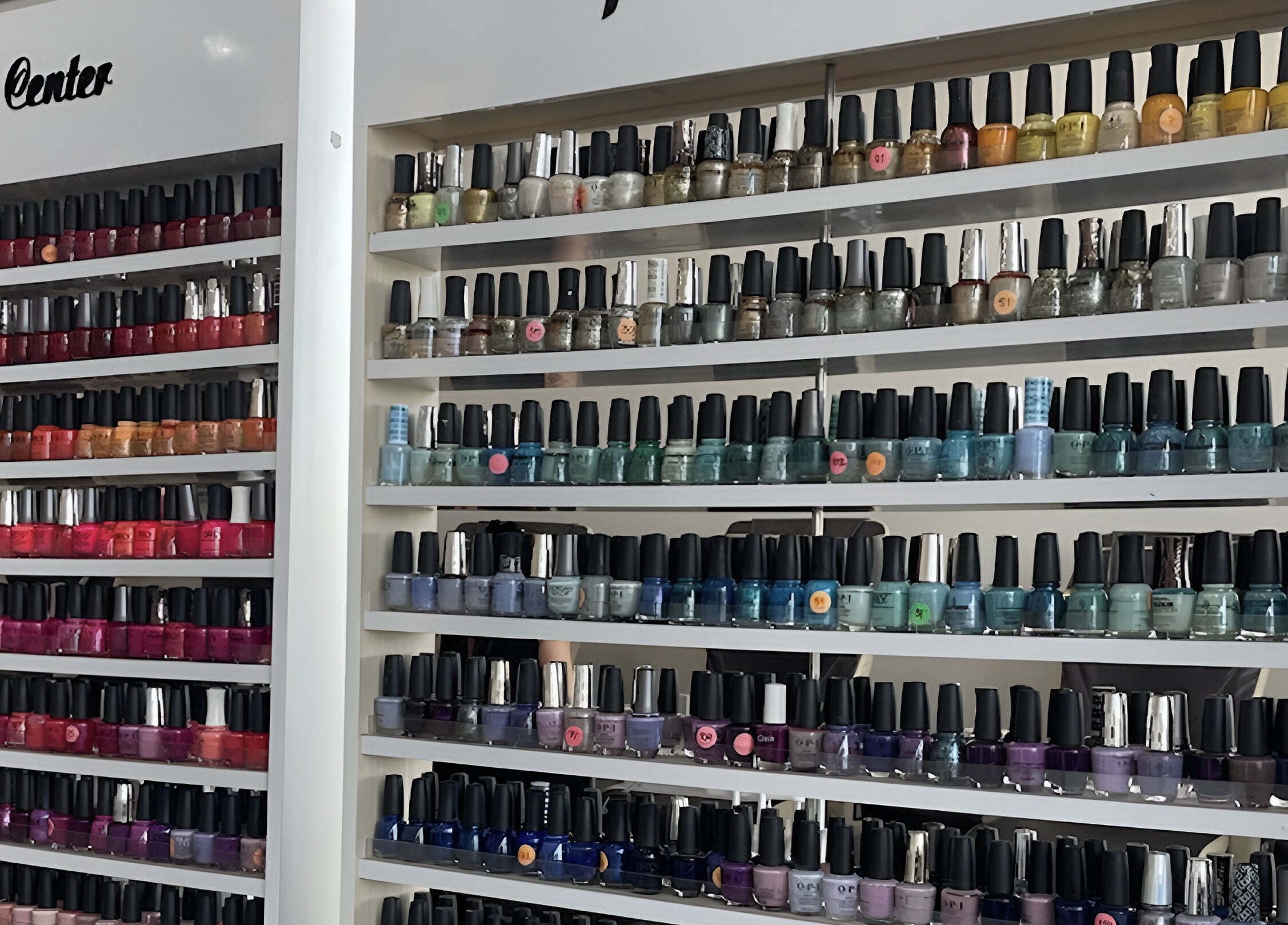 Colorful wall of nail polishes at D'Luxe Nail-Ocotillo, Chandler, Arizona, US.