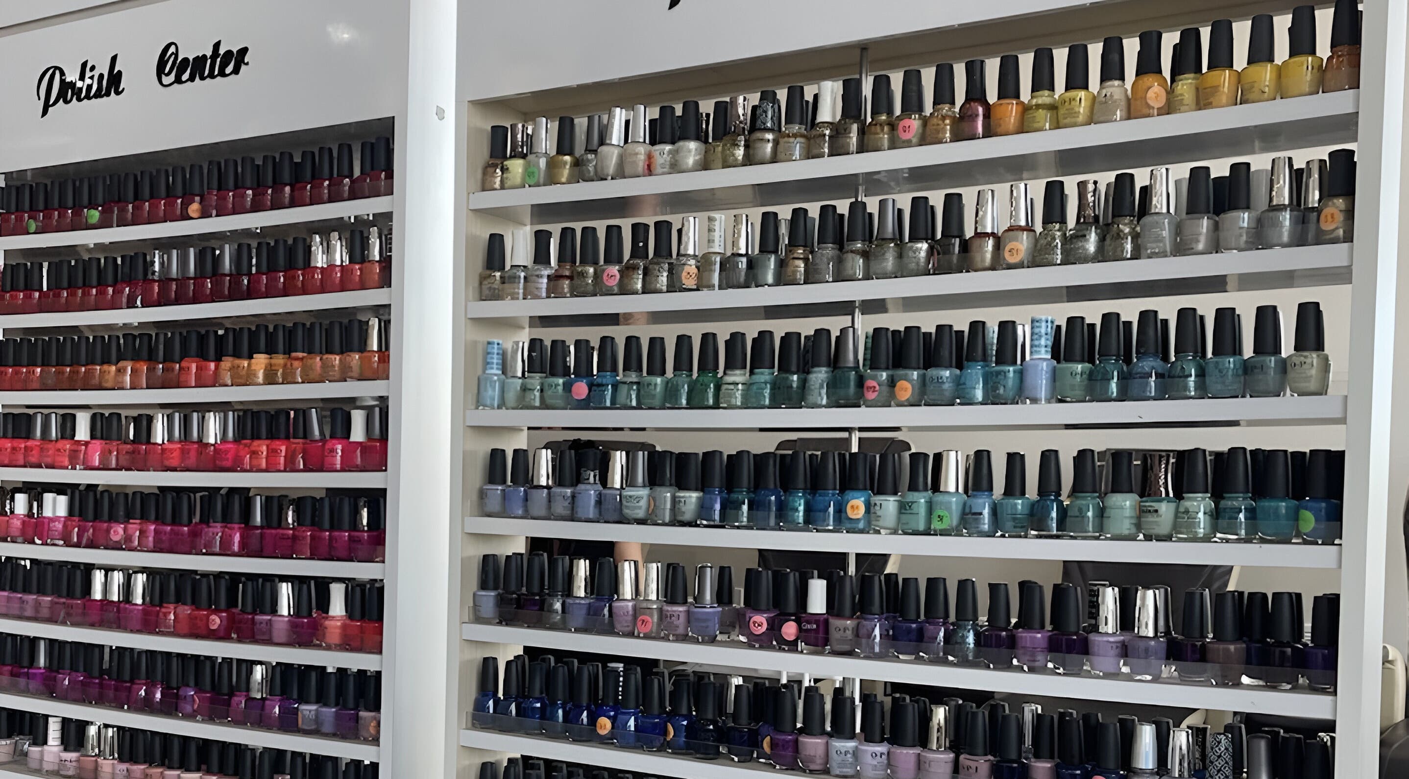 Colorful wall of nail polishes at D'Luxe Nail-Ocotillo, Chandler, Arizona, US.