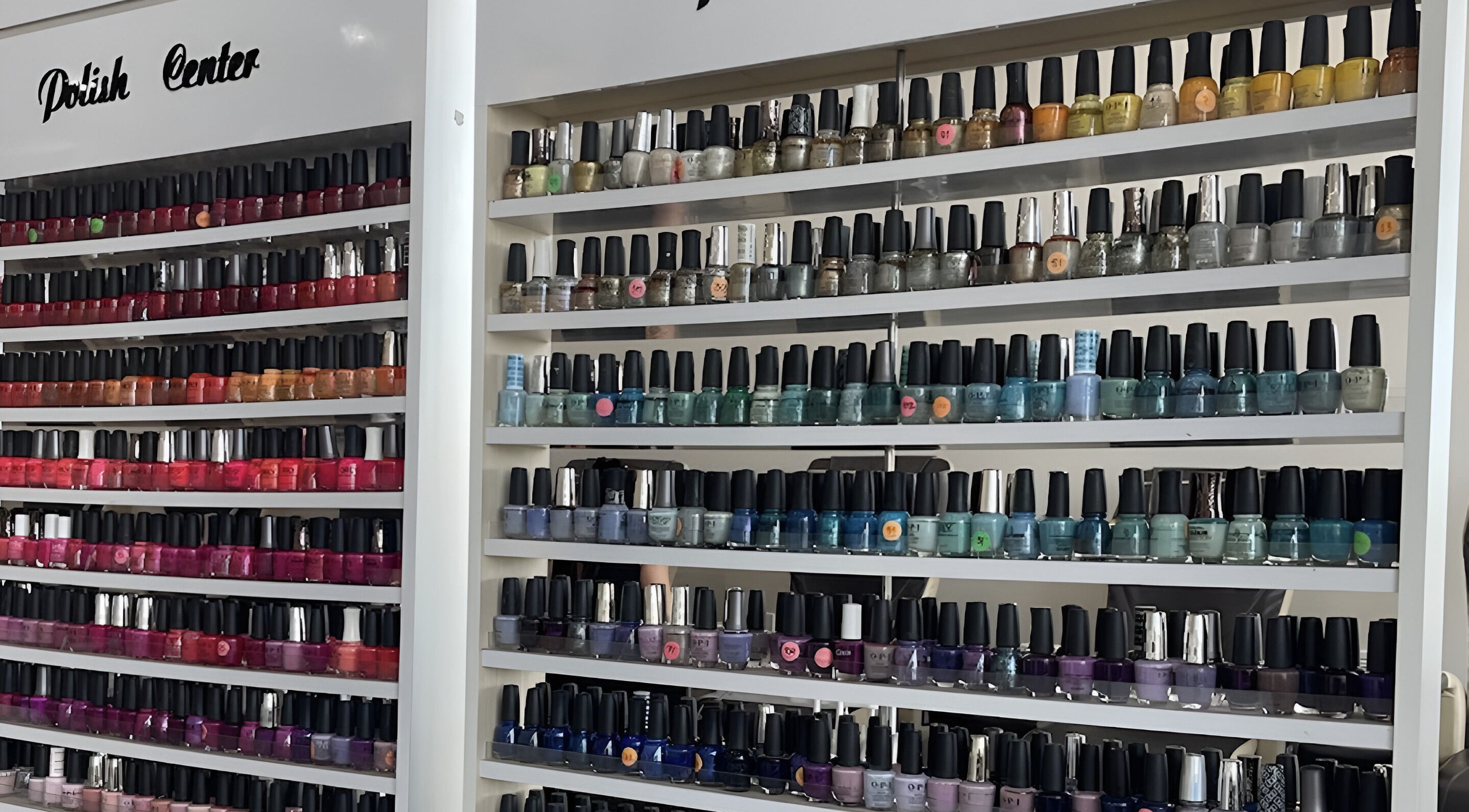 Colorful wall of nail polishes at D'Luxe Nail-Ocotillo, Chandler, Arizona, US.