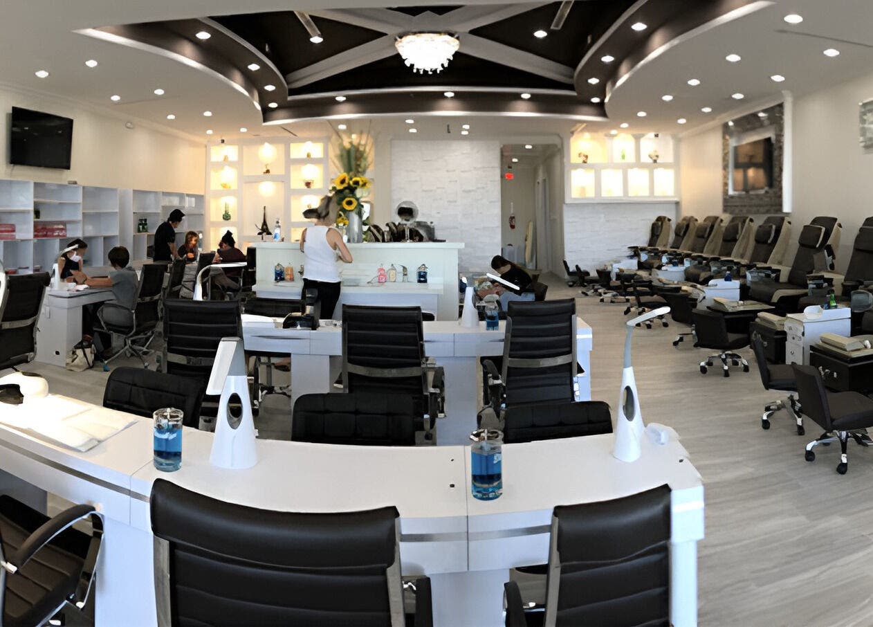 Inside view of D'Luxe Nail-Ocotillo, Chandler, Arizona, US, featuring sleek nail stations and cozy chairs.