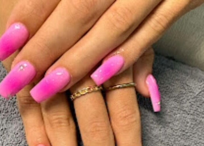 Vibrant pink nails design at D'Luxe Nail-Ocotillo, Chandler, Arizona, US, showcasing top-tier nail art.