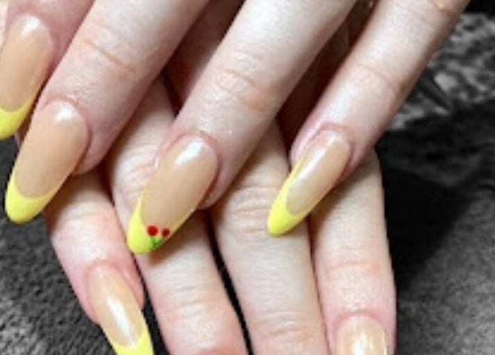 Stylish lemon-yellow tipped nails at D'Luxe Nail-Ocotillo, Chandler, Arizona, US, near Dunkin'.