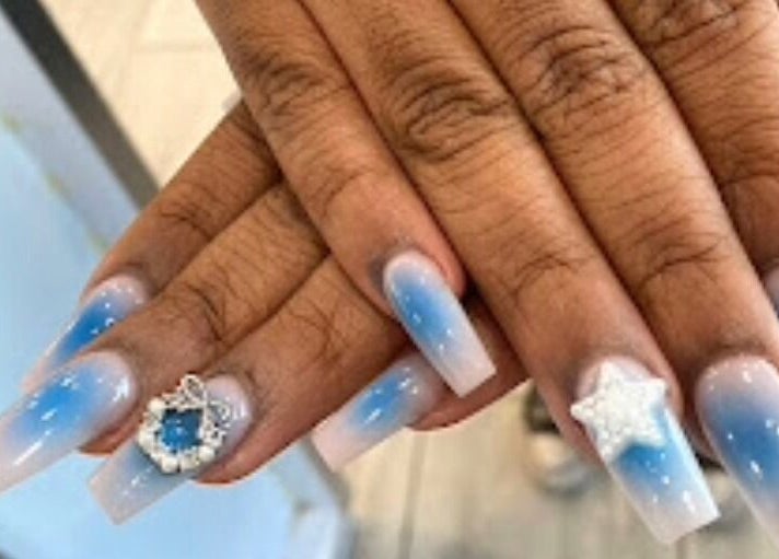 Elegant blue ombre nails with star and gem design at D'Luxe Nail-Ocotillo, Chandler, Arizona, US.