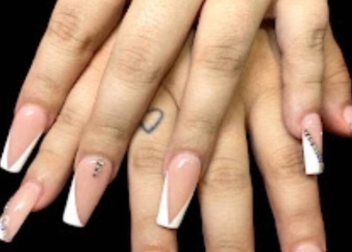 Elegant manicured nails with rhinestones at D'Luxe Nail-Ocotillo, Chandler, Arizona, US.