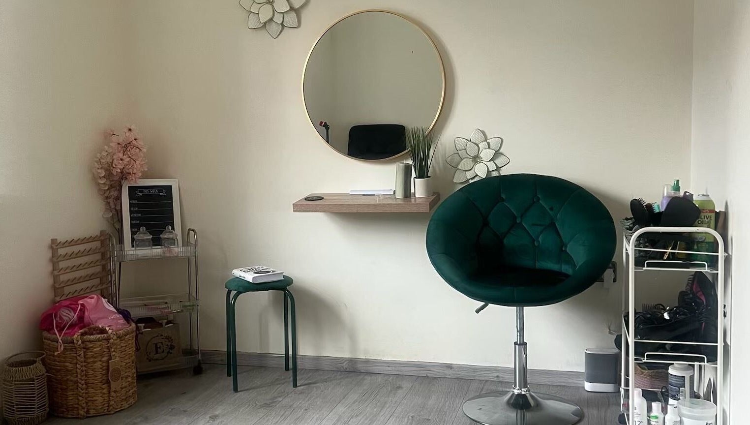 Cozy corner at Ace Beauty Bar, Peterborough, England, GB with plush chair, mirror, and decor.
