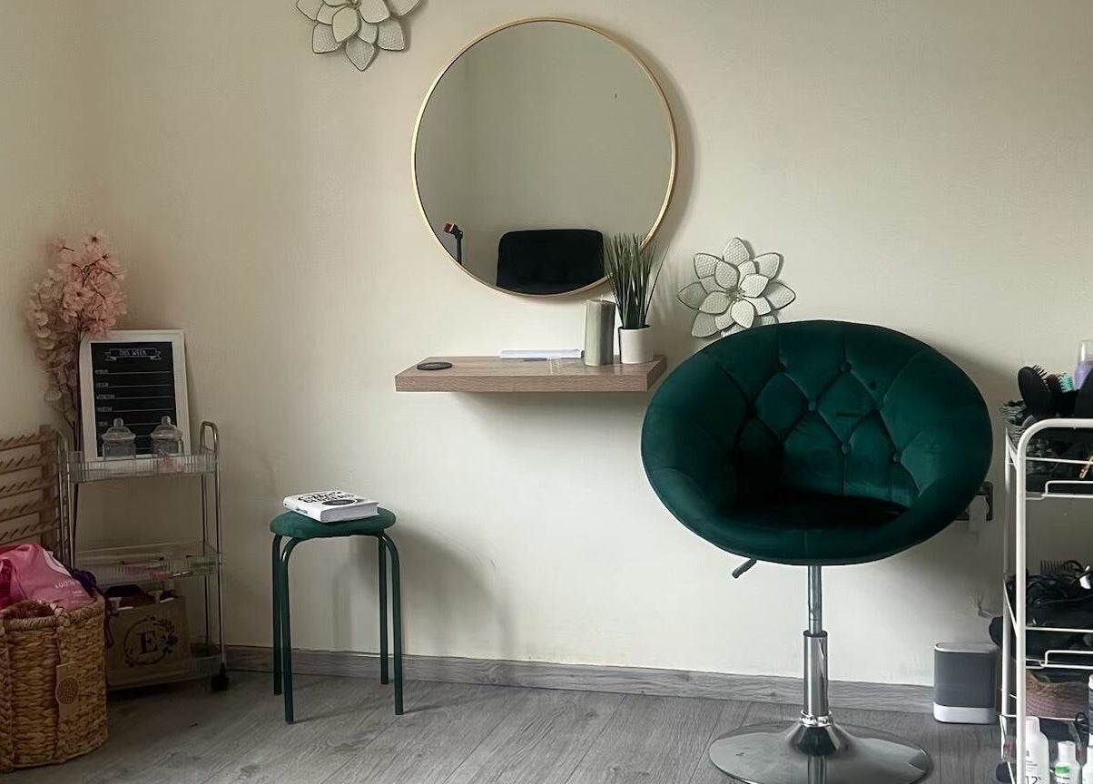 Cozy corner at Ace Beauty Bar, Peterborough, England, GB with plush chair, mirror, and decor.