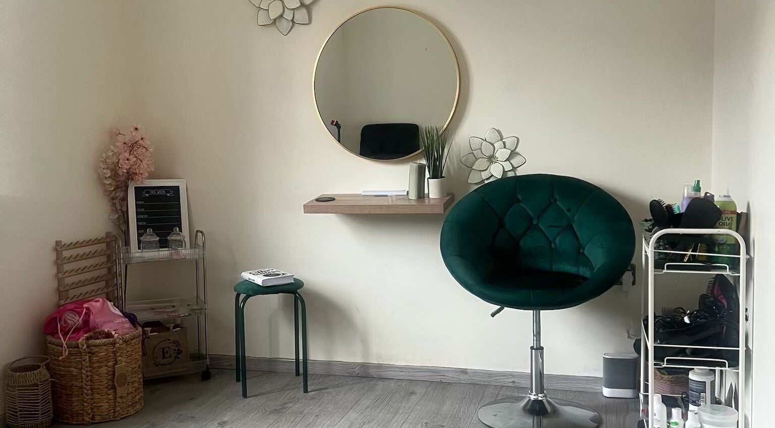 Cozy corner at Ace Beauty Bar, Peterborough, England, GB with plush chair, mirror, and decor.