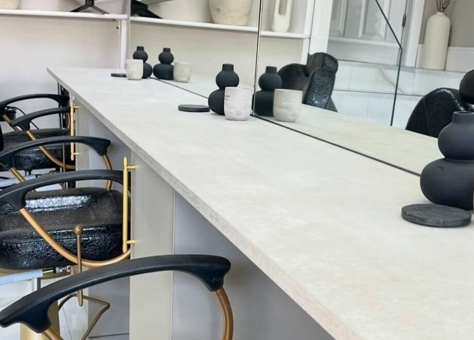 Chic nail station at Lush Nails by Leah, Leeds, England, GB, featuring black chairs and modern decor.