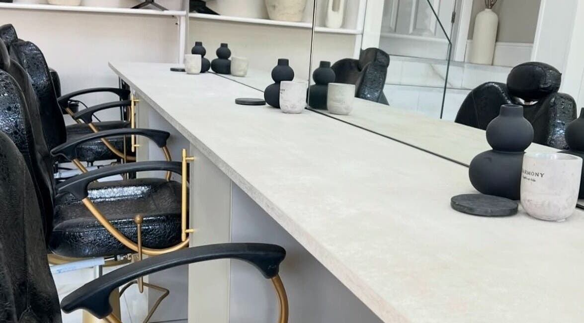 Chic nail station at Lush Nails by Leah, Leeds, England, GB, featuring black chairs and modern decor.