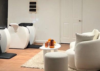 Modern seating area and wellness machines at Orange Health Collective, North Bondi, New South Wales, AU.
