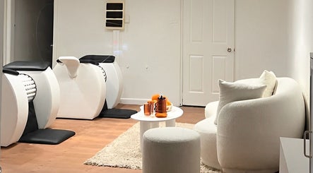 Modern seating area and wellness machines at Orange Health Collective, North Bondi, New South Wales, AU.