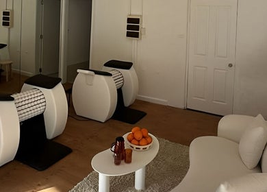 Relaxing wellness room at Orange Health Collective, North Bondi, New South Wales, AU, featuring cozy seating.