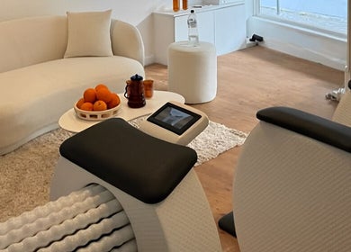 Cozy wellness area at Orange Health Collective, North Bondi, NSW, AU, featuring massage rollers and a couch.