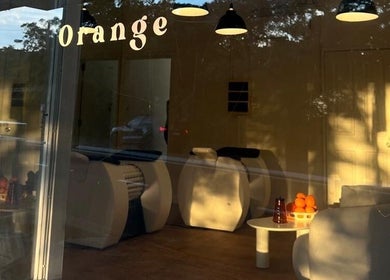 Interior view of Orange Health Collective in North Bondi, New South Wales, showcasing a warm spa setting.