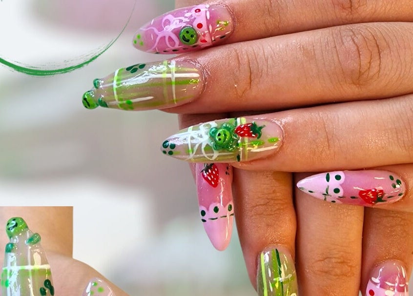 Vibrant strawberry-themed nail art at Cuteikell Nail Design, Plympton, England, GB. Creative and intricate detailing.