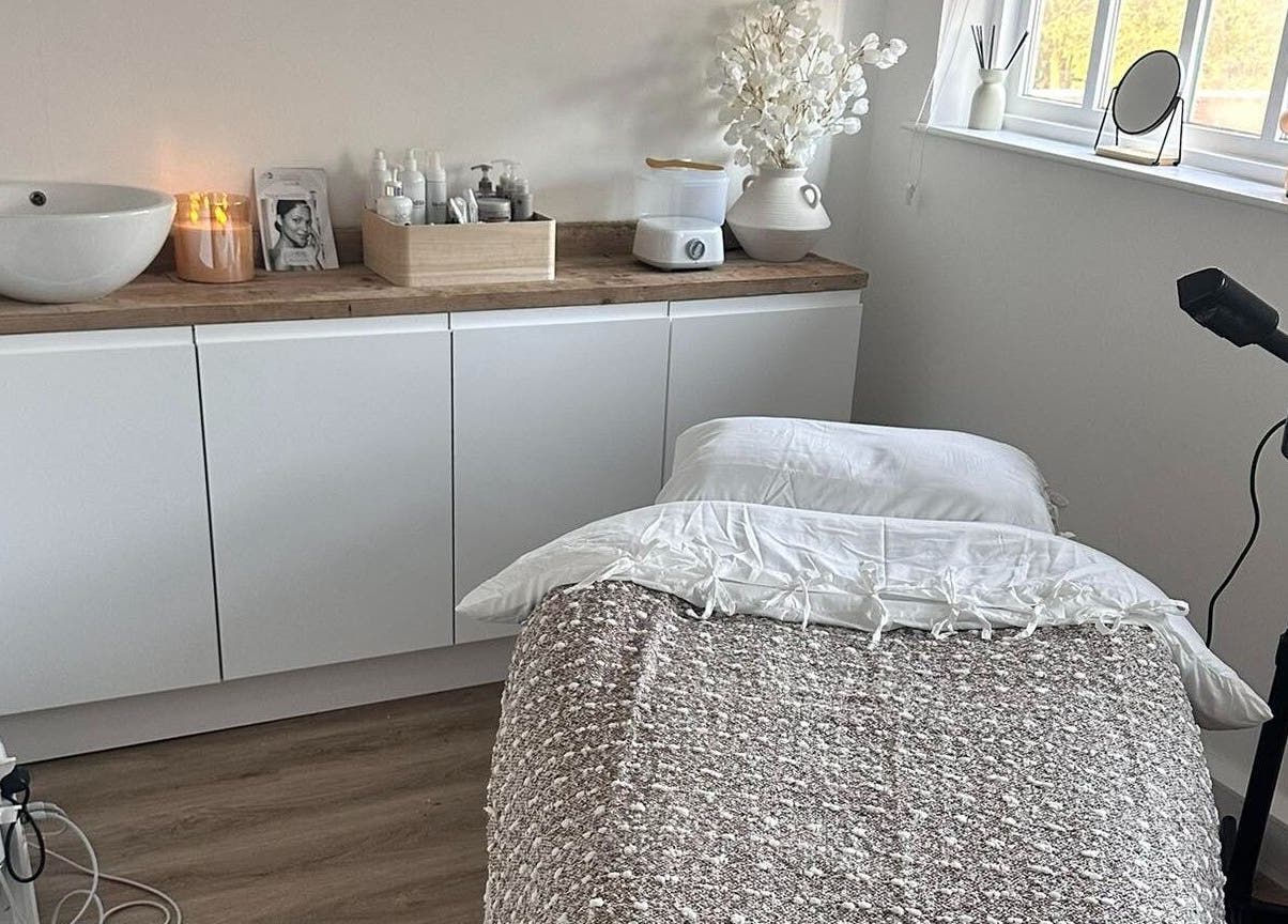 Calming therapy room at Skin Muse by Emma, Stratton Audley, England, GB, featuring a cozy massage table.