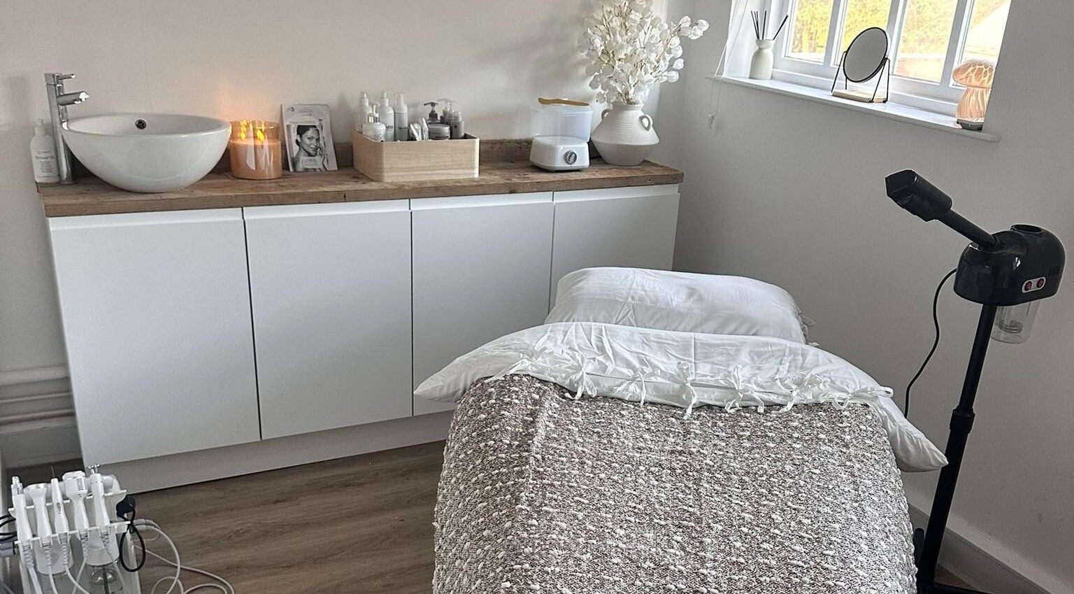 Calming therapy room at Skin Muse by Emma, Stratton Audley, England, GB, featuring a cozy massage table.