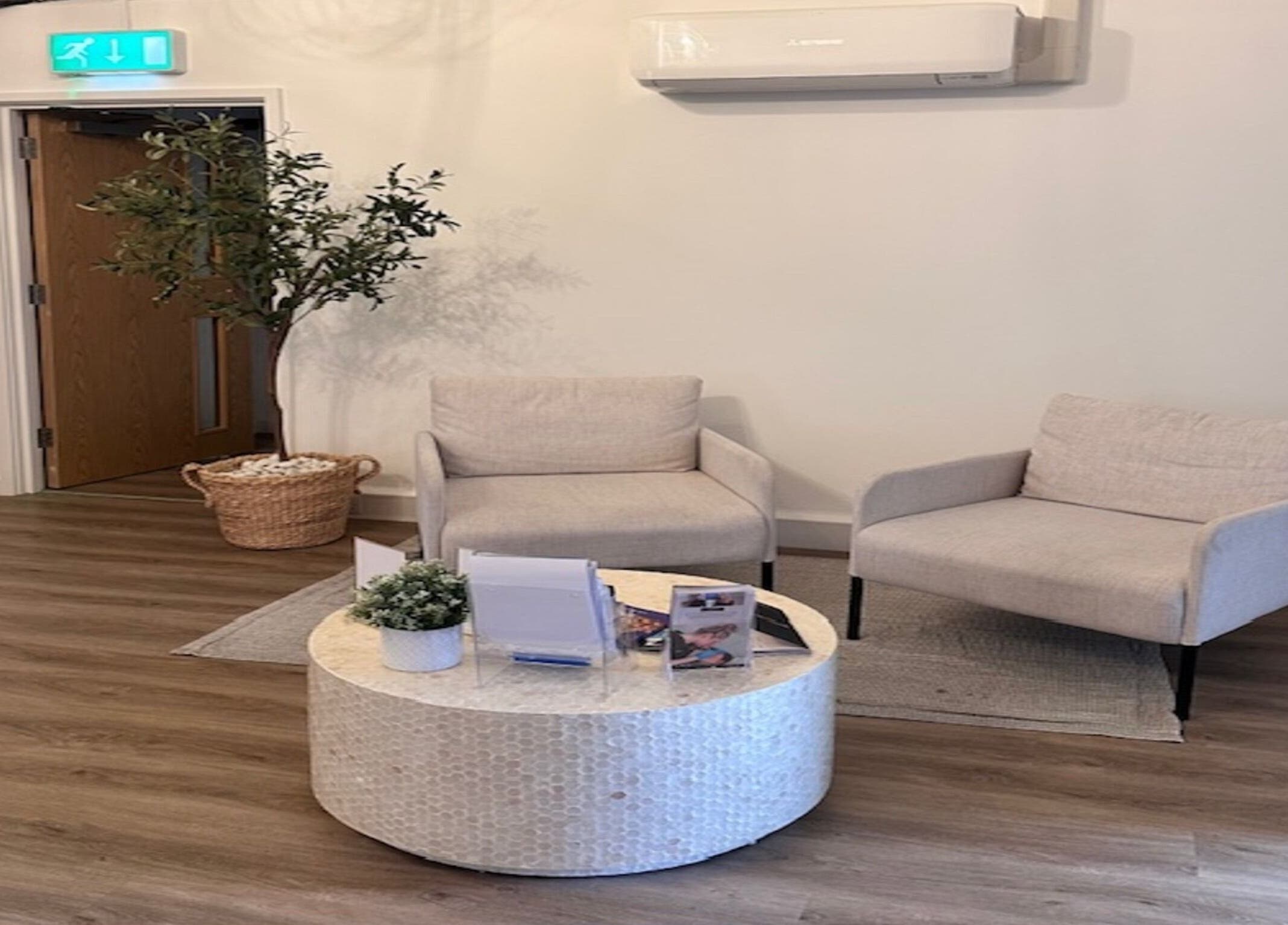 Elegant waiting area at Skin Muse by Emma, Stratton Audley, England, GB showcasing stylish seating and decor.