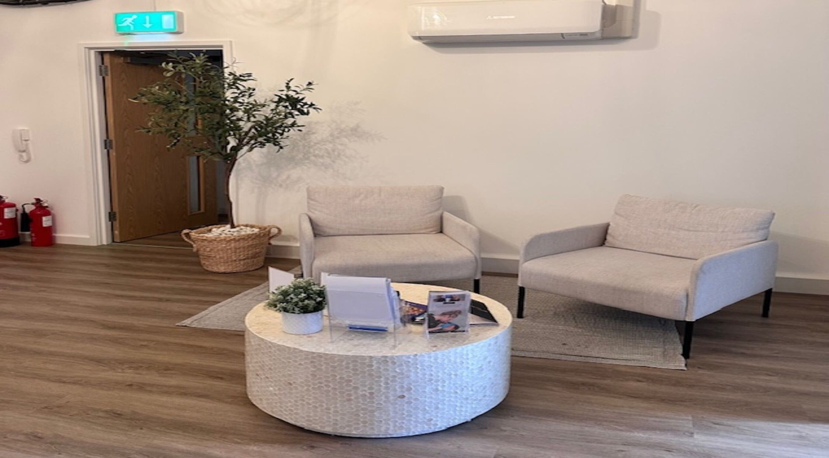 Elegant waiting area at Skin Muse by Emma, Stratton Audley, England, GB showcasing stylish seating and decor.