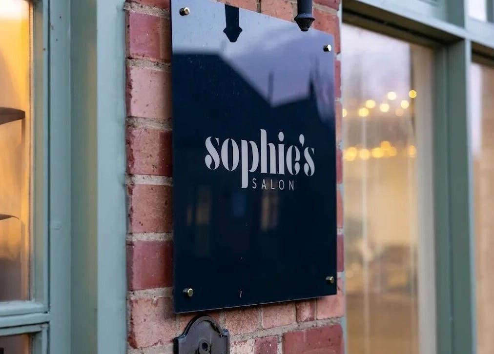 Exterior view of Skin Muse by Emma in Stratton Audley, elegant salon sign on brick facade.