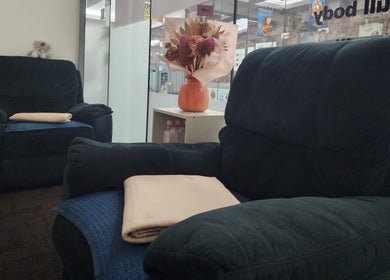 Plush chairs and floral decor at G'Day Massage Perth, Western Australia, AU offer relaxation and comfort.