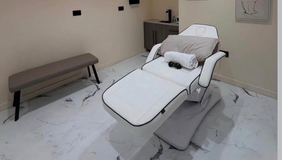 Luxurious treatment bed at Laser Lounge, Ramsbottom, England, GB, offering a serene and relaxing wellness experience.