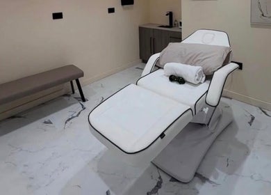 Luxurious treatment bed at Laser Lounge, Ramsbottom, England, GB, offering a serene and relaxing wellness experience.