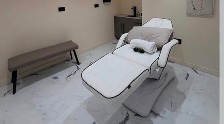 Luxurious treatment bed at Laser Lounge, Ramsbottom, England, GB, offering a serene and relaxing wellness experience.