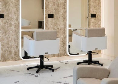 Modern salon chairs and mirrors at Laser Lounge, Ramsbottom, England, GB. Perfect blend of style and comfort.
