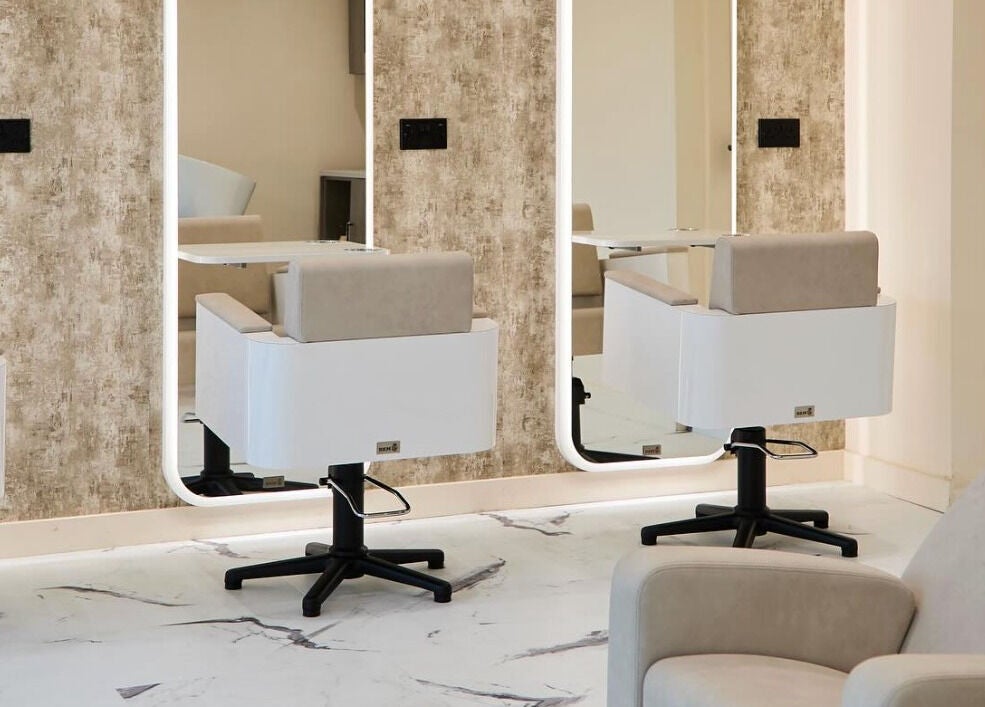 Modern salon chairs and mirrors at Laser Lounge, Ramsbottom, England, GB. Perfect blend of style and comfort.