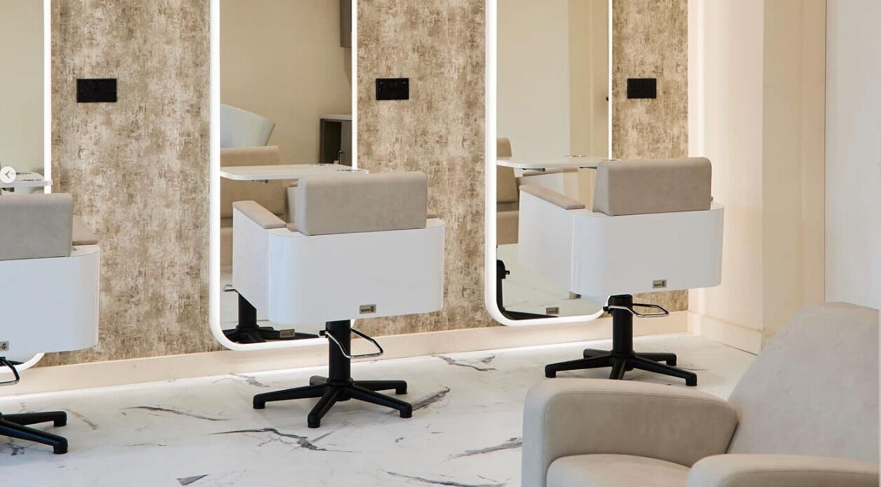 Modern salon chairs and mirrors at Laser Lounge, Ramsbottom, England, GB. Perfect blend of style and comfort.