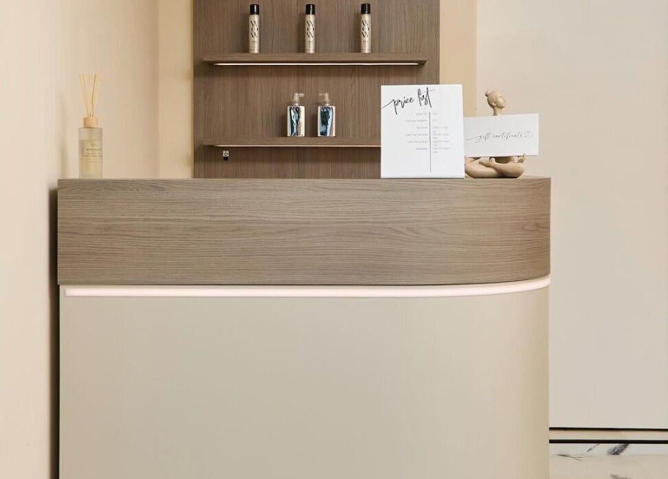 Elegant reception desk at Laser Lounge in Ramsbottom, England, GB with decor and product display.